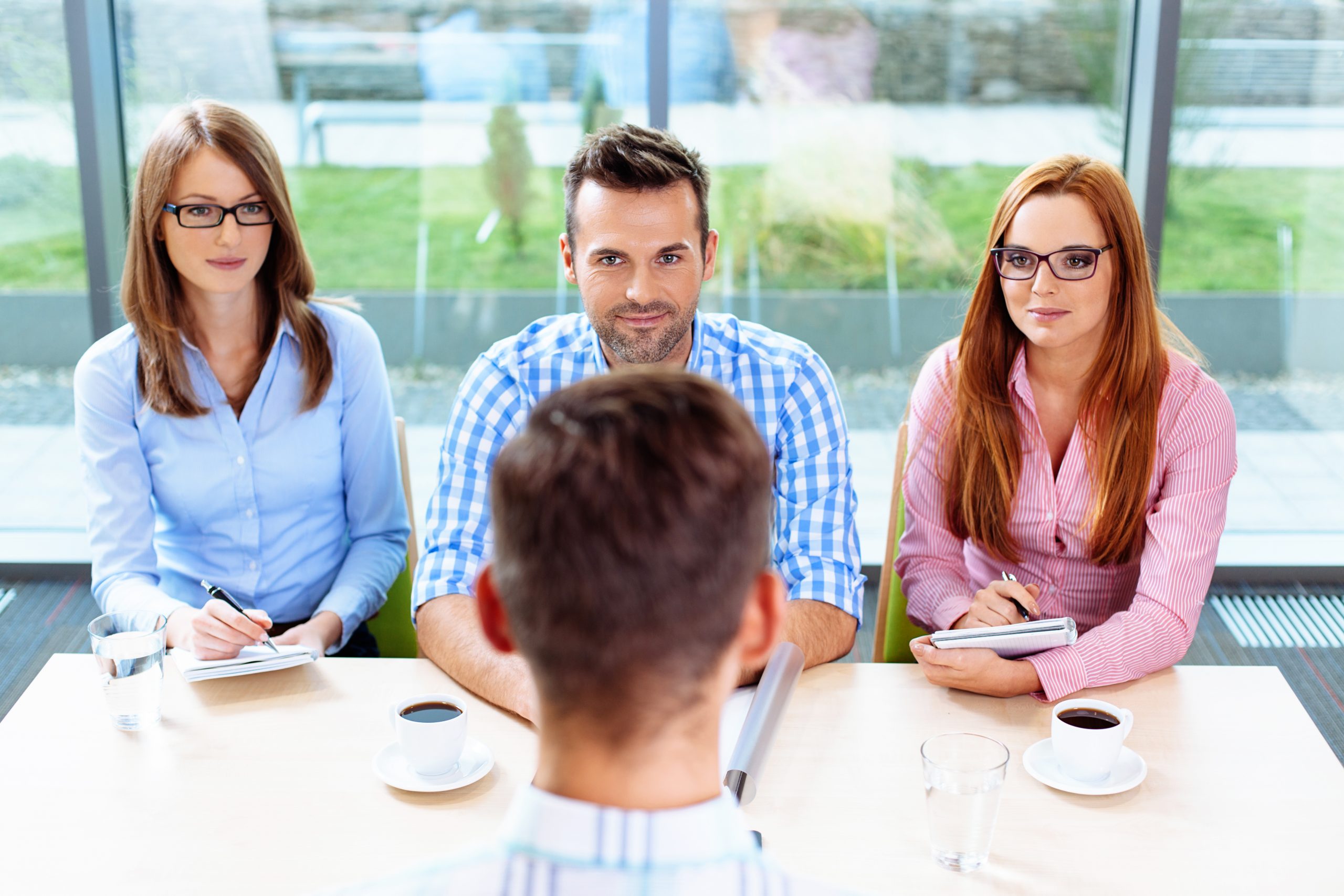 Interview.,Three,Corporate,People,Interview,Young,Man